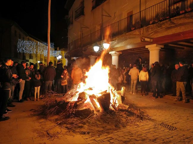 A bonfire is lit in the square